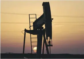  ?? HASAN JAMALI/AP FILES ?? An oil pump is shown in the desert oilfields of Sakhir, Bahrain. The stakes are raised for investors as OPEC and its partners will decide whether to extend the output agreement next week.