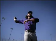  ?? ?? Justin Lawrence (61) of the Colorado Rockies warms up during Spring Training at Salt River Fields in Scottsdale, Arizona on Wednesday, Feb. 21, 2024.