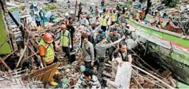  ?? FERDI AWED/GETTY-AFP ?? Crews look for survivors Sunday in South Lampung on South Sumatra after the tsunami.