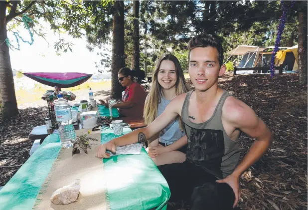  ?? Picture: STEWART McLEAN ?? KICKING BACK: Far North Queensland’s long dry spell will again restrict holiday activities on Lake Tinaroo with a six-knot speed limit extending into the new year. Lindsay Samson and Jack McCahon relax while camping on the edge of the popular waterway.