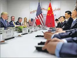  ?? Brendan Smialowski AFP/Getty Images ?? U.S. and Chinese officials meet on the sidelines of the recent G20 summit in Japan. It was there that the U.S. agreed not to impose new tariffs on China.