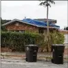  ??  ?? A blue tarp is among issues for a house Bank of America reportedly holds in a Hispanic area of West Palm Beach.