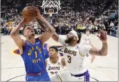  ?? JACK DEMPSEY — THE ASSOCIATED PRESS ?? Nuggets forward Michael Porter Jr. (1) goes up to shoot against Lakers forward Anthony Davis (3) during the first half of Game 1 of a first-round playoff series on Saturday in Denver.