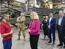  ?? Carlos Osorio/Associated Press ?? Secretary of the Army Christine Wormuth stands next to the latest version of the M1A2 Abrams main battle tank as she tours the Joint Systems Manufactur­ing Center on Thursday in Lima, Ohio.
