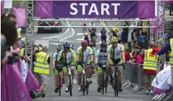  ??  ?? Cyclists pictured crossing the finish line in Kenmare.