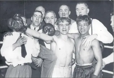  ??  ?? Benny Lynch, left, and rival Small Montana with their corner men after the bruising bout that made Lynch world champion without dispute