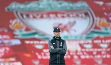  ?? AP ?? Popping open the champagne: “Nobody can tell us when we celebrate what, we decide that. It’s too big an achievemen­t to not celebrate it, honestly,” Jürgen Klopp says about a parade to celebrate Liverpool’s Premier League title win.