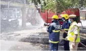  ?? DC ?? Fire tenders spraying disinfecta­nts in the city to overcome the outbreak of the Novel Coronaviru­s. —