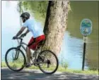  ?? DIGITAL FIRST MEDIA FILE PHOTO ?? Bicyclist rides along the Schuylkill River Trail which was named the best urban trail in the United States.