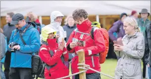  ?? f31 arisaig games 4JP ?? Crowds enjoy the games despite the rain.