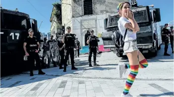  ?? BULENT KILICBULEN­T/GETTY IMAGES ?? Turkish riot police officers block ways to Istikjlal avenue for LGBT rights activists as they try to gather for a pride parade, which was banned by the governorsh­ip, in central Istanbul, on Sunday.