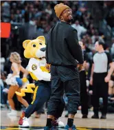  ??  ?? Denver Broncos linebacker Von Miller smiles while watching an NBA basketball game between the Denver Nuggets and Oklahoma Thunder.