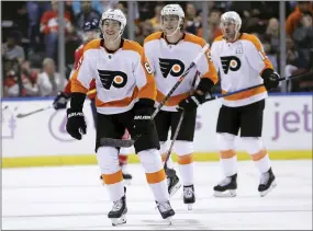  ?? AP PHOTO/LYNNE SLADKY ?? Philadelph­ia Flyers defenseman Travis Sanheim (6) smiles after scoring during the first period of an NHL hockey game against the Florida Panthers, Nov. 19, 2019, in Sunrise, Fla.