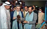  ?? ?? Union Minority Affairs Minister Mukhtar Abbas Naqvi (R) with Iran Ambassador to India H.E. Dr. Ali Chegeni (C) and Ambassador of Kuwait to India Jasem Ibrahem Al Najem (L) during the inaugurati­on of the 33rd Hunar Haat at Pragati Maidan, in New Delhi on 15 November 2021. ANI