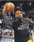  ?? ROBERT DEUTSCH/ USA TODAY SPORTS ?? In 2014, LeBron James wore an “I Can't Breathe” T- shirt during a pregame warm- up.