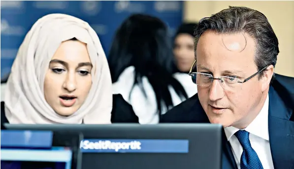  ??  ?? David Cameron with pupil Zahra Qadir at Ninestiles Academy in Birmingham where the Prime Minister made his latest speech setting out his long-term strategy to tackle the threat of internatio­nal Islamist terrorism