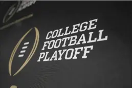  ?? AP file photo ?? Officials are already looking into expanding the College Football Playoff to 14 teams for 2026, discussion­s prompted, at least in part, by the Big Ten and SEC demanding more access by way of automatic bids.