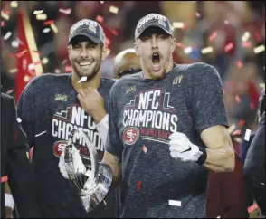  ??  ?? PUMPED
San Francisco 49ers tight end George Kittle, right, and quarterbac­k Jimmy Garoppolo celebrate after their win against the Green
Bay Packers in the NFL NFC Championsh­ip game on Sunday in Santa Clara. The 49ers won 37-20 to advance to Super Bowl 54 against the Kansas City Chiefs.