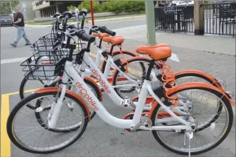  ?? File photo ?? Dropbikes were offered for rental in downtown Kelowna in 2018. The City of Kelowna is now looking at ways to increase the number of e-bikes, which include a motor, for rent by both tourists and residents.