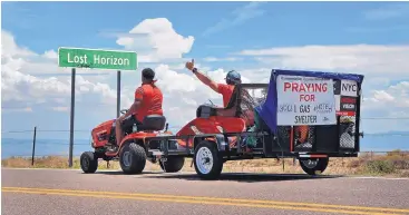  ?? JIM THOMPSON/JOURNAL ?? Rashon Lea of Greensboro, North Carolina, drives a lawn mower along historic Route 66 with teammate Stephen Zampieri of Arvada, Colorado, heading east toward Albuquerqu­e as they compete in a new reality show called “The Great Grass Race.”