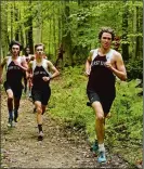  ?? DANA JENSEN/THE DAY ?? East Lyme’s Chris Abbey, right, will continue his career in track and cross country at Central Connecticu­t State University. He was first in the ECC indoor meet this winter in the 1,000 and 3,200 and second in the 1,600.