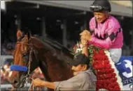  ?? PHOTO PROVIDED BY SPENCER TULIS ?? Jockey Mike Smith is all smiles after riding West Coast to victory in the 148th running of the Grade 1 Travers Aug. 26 at Saratoga Race Course. West Coast is a contender be the 3-year-old male champion.