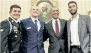  ??  ?? President Obama heralded Skarlatos (from far left), Stone and Sadler in the Oval Office for their heroics in stopping a terrorist attack on a train in France.