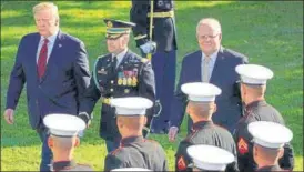  ?? REUTERS ?? ■ US President Donald Trump (left) and Australian PM Scott Morrison (right) review troops during an official arrival ceremony on the South Lawn of the White House in Washington.