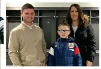  ??  ?? In a spin: Academy player Jaden Neale poses proudly with his dad Mike and mum Laura