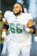  ?? DOUG MURRAY/AP ?? Dolphins offensive lineman Robert Hunt runs onto the field before a game against the Browns on Nov. 13 in Miami Gardens.