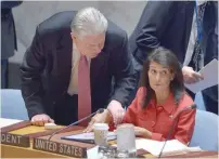  ?? — AFP ?? Ukraine’s Ambassador to UN Volodymyr Yelchenko (L) talks to US Ambassador to the UN and current UN Security Council President Nikki Haley before the Security Council meeting on Syria, at the UN headquarte­rs in New York on Friday.