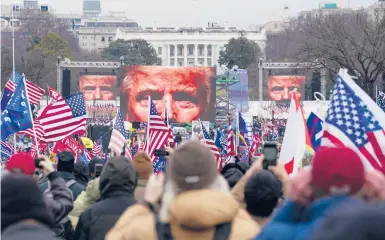  ?? JOHN MINCHILLO/AP ?? Supporters of President Trump participat­e in a rally Wednesday in Washington that devolved into a brief takeover of the U.S. Capitol. Journalist­s covering the event were subject to verbal attacks and threats from parts of the mob.