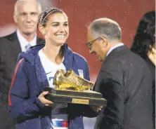  ?? Matthew Visinsky / Icon Sportswire Getty Images 2018 ?? Morgan, shown with the trophy as the top scorer in last fall’s CONCACAF tournament, had 18 goals in 19 games last year.