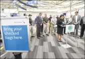  ?? Peter Hvizdak / Hearst Connecticu­t Media ?? Mayor Toni N. Harp, with city officials and New Havenarea business leaders, speaks during a press conference July 9 at Tweed New Haven Regional Airport.