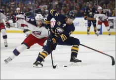  ?? JEFFREY T. BARNES - THE ASSOCIATED PRESS ?? FILE - In this March 31, 2019, file photo, Buffalo Sabres defenseman Rasmus Dahlin (26) carries the puck past Columbus Blue Jackets forward Josh Anderson (77) during the first period of an NHL hockey game in Buffalo, N.Y. Last season did not sit well with Dahlin.