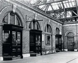  ??  ?? The foyer at Foyle Road, showing the panels on the refreshmen­t room doors. HEADHUNTER­S RAILWAY MUSEUM AND BARBERSHOP