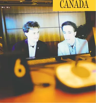  ?? SEAN KILPATRICK / THE CANADIAN PRESS ?? Marc and Craig Kielburger, seen via videoconfe­rence at a House of Commons finance committee meeting late last month, were not on a list of 20 WE organizati­on representa­tives registered to lobby, it was disclosed on Thursday.