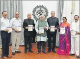  ??  ?? ▪ Governor Ram Naik and members of the UP Board for Developmen­t of Municipal Financial Resources holding ‘Ek Drishti’ a booklet detailing the board’s work during the last financial year.