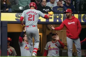  ?? (AP Photo/ Morry Gash) ?? St. Louis Cardinals’ Lars Nootbaar is congratula­ted after hitting a home run during the third inning of Thursday’s game against the Milwaukee Brewers in Milwaukee.