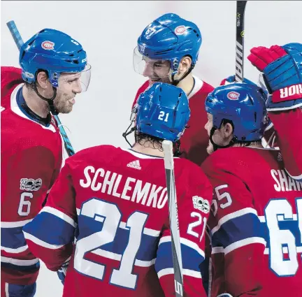  ?? THE CANADIAN PRESS ?? Canadiens defenceman Shea Weber, left, is congratula­ted by teammates after scoring on a second-period blast from the point in Tuesday night’s 4-3 loss to St. Louis. Weber scored a pair of goals on almost identical plays with Andrew Shaw, right, winning...