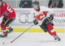  ?? Stuart Gradon/Calgary Herald ?? Johnny Gaudreau, seen here wheeling around the ice during a rookie scrimmage, looks ready to make the Flames’ roster in September.