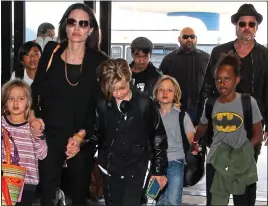  ??  ?? CUSTODY FIGHT: Jolie and Pitt with their children before their bitter split