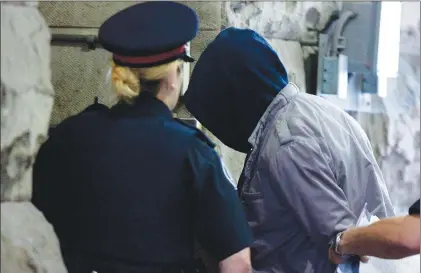  ?? CP PHOTO ?? Christophe­r Husbands arrives in court in Toronto on June 4, 2012. An appeal court has overturned Husbands’ conviction­s, saying the trial judge made an irreparabl­e mistake by overruling a defence request regarding the method of jury selection.