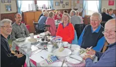  ??  ?? Not just about the golf: Captains Day at Machrie Golf Club also saw golfers enjoying a feast of cakes and sandwiches.