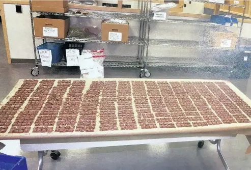  ?? ONTARIO COURT OF JUSTICE / THE CANADIAN PRESS ?? Marijuana-laced chocolate bars are shown at a pot shop in Toronto during a raid in this evidence photo. Vittorio Dominelli says he is ashamed of eating parts of one bar on Jan. 27, becoming “seriously intoxicate­d.”