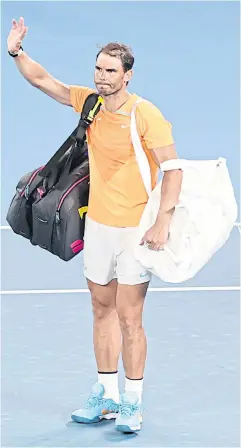  ?? AFP ?? Rafael Nadal waves to the crowd after losing to Mackenzie McDonald in the second round of the Australian Open yesterday.