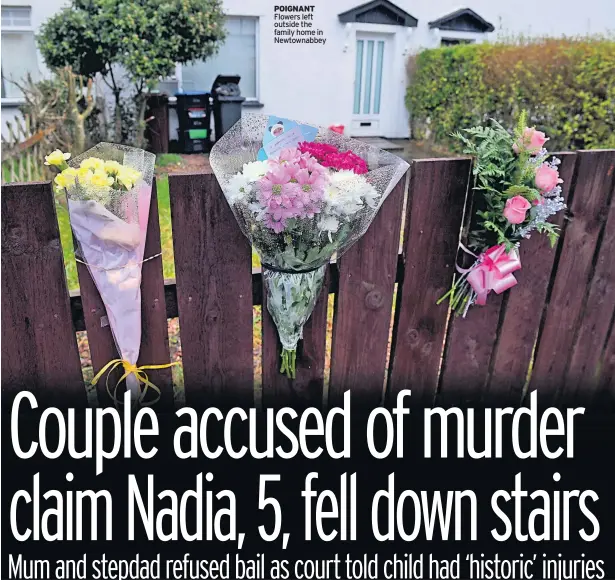  ??  ?? POIGNANT Flowers left outside the family home in Newtownabb­ey