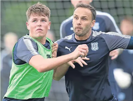  ?? Pictures: David Young. ?? Lewis Spence, left, challenges Dark Blues team-mate Tom Hateley at training yesterday.