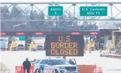  ?? LARS HAGBERG/AFP ?? A sign says that the border is closed at the U.S.-Canada border in March in Lansdowne, Ontario.