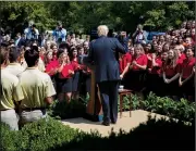  ?? AP/CAROLYN KASTER ?? President Donald Trump speaks Wednesday to a gathering of the American Legion Boys Nation and the American Legion Auxiliary Girls Nation in the White House Rose Garden hours after his proclamati­on on transgende­r military personnel. Trump said in a...